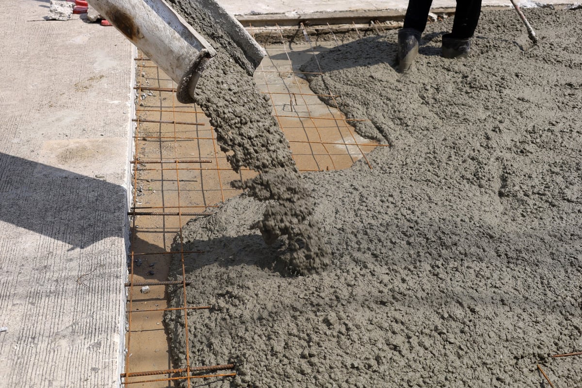 Wet cement pouring from a mixer truck chute